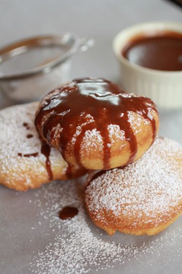 Beignets….filled with Chocolate…..then drizzled with Chocolate Hazelnut Sauce