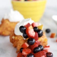 Corn Fritters with Coconut Whipped Cream and Sweet Honey Bourbon Syrup.