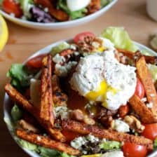 Steak and French Fry Salad with Blue Cheese Butter + Poached Eggs