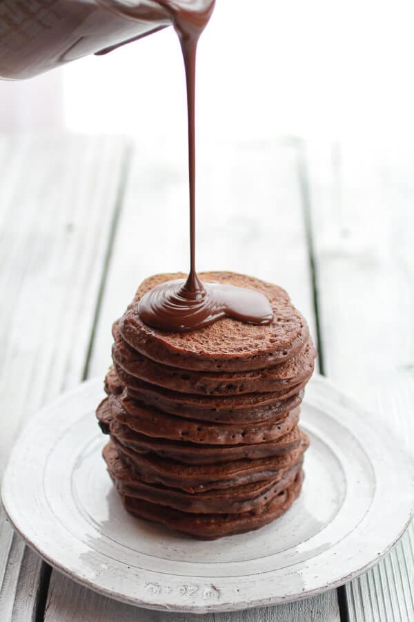 Chocolate Lovers Pumpkin Fudge Brownie Pancakes with Chocolate Kahlua Sauce | halfbakedharvest.com 