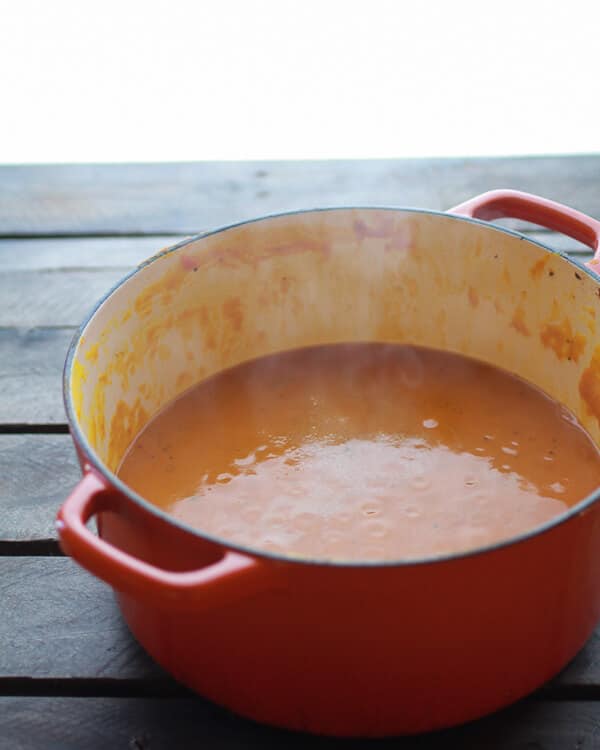 Roasted Garlic Sage Pesto Pumpkin Soup with Spicy Fried Pumpkin Seeds | halfbakedharvest.com