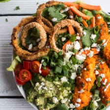 Buffalo Chicken + Blue Cheese Guacamole and Crunchy Baked Onion Ring Salad.