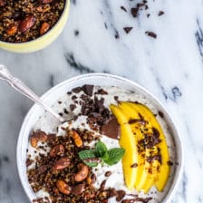 Coconut Banana Oats Bowl with Crunchy Black Sesame Quinoa Cereal + Mango.