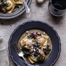 Taleggio Ravioli with Garlicy Butter Kale and Mushroom Sauce + Toasted Pine Nuts.