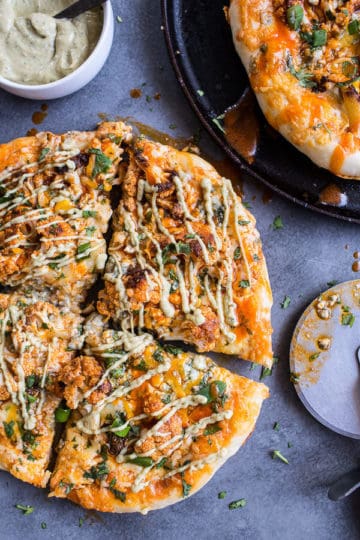 Buffalo Roasted Cauliflower Pizza with Chipotle Blue Cheese Avocado Drizzle.