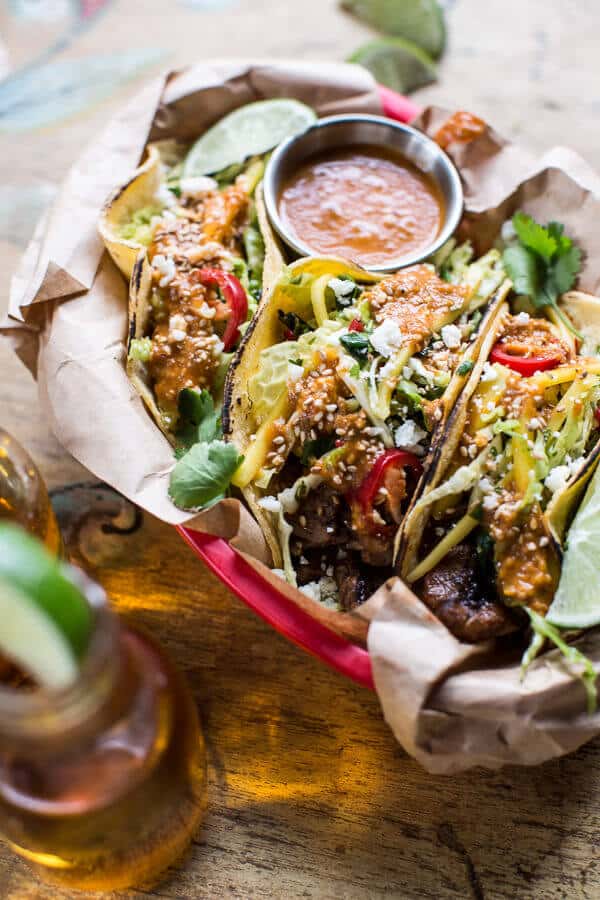 Bulgogi BBQ Pork Tacos with Charred Tomatillo Sesame Sauce + Spring Onion Slaw | halfbakedharvest.com