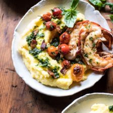 Brown Butter Lobster with Kale Pesto Polenta and Cherry Tomato Bacon Pan Sauce.