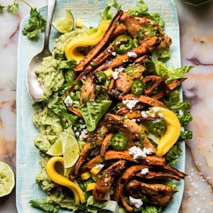overhead photo of chipotle chicken and sweet potato salad with vinaigrette in photo