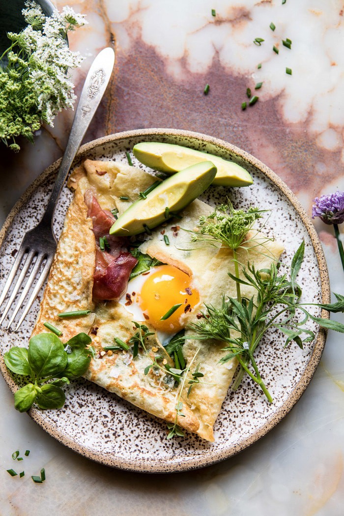 close up overhead photo of Baked Egg Crepes with Spring Herbs and Avocado