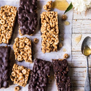Chocolate Dipped Peanut Butter and Honey Cheerio Bars | halfbakedharvest.com #chocolate #dessert #easyrecipe