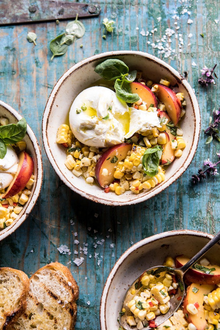 overhead photo of Spicy Corn and Peaches with Burrata with burrata broken