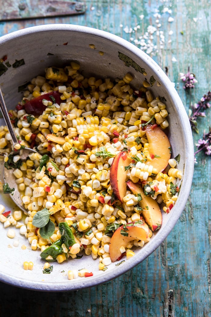 angled photo of Spicy Corn and Peaches with Burrata in big salad bowl