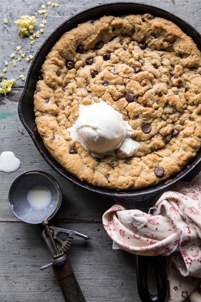 close up overhead photo of Whole Wheat Chocolate Chip Skillet Cookie with ice cream