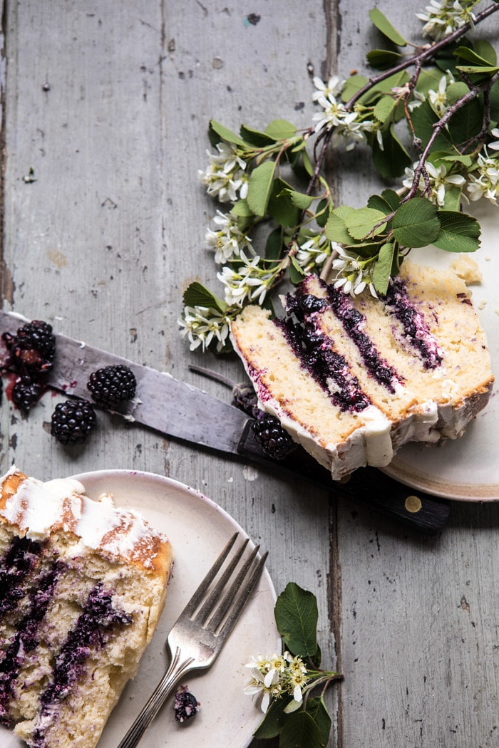 overhead photo of Blackberry Lavender Naked Cake with two cake pieces in photo