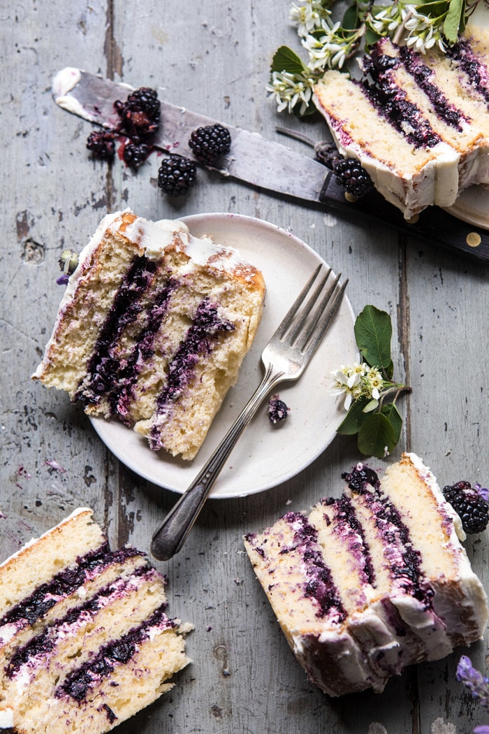 overhead photo of Blackberry Lavender Naked Cake slices, four slices in photo with fork