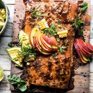 Honey Ginger Cedar Plank Grilled Salmon with Avocado Salsa | halfbakedharvest.com #salmon #summerrecipes #healthyrecipes #easy