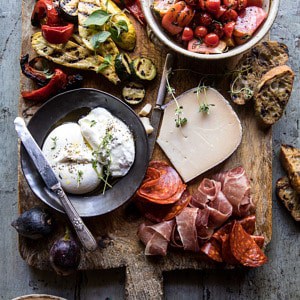 Marinated Tomato and Grilled Veggie Cheese Board | halfbakedharvest.com #cheeseboard #summerrecipes #easy #4thofjulyrecipe