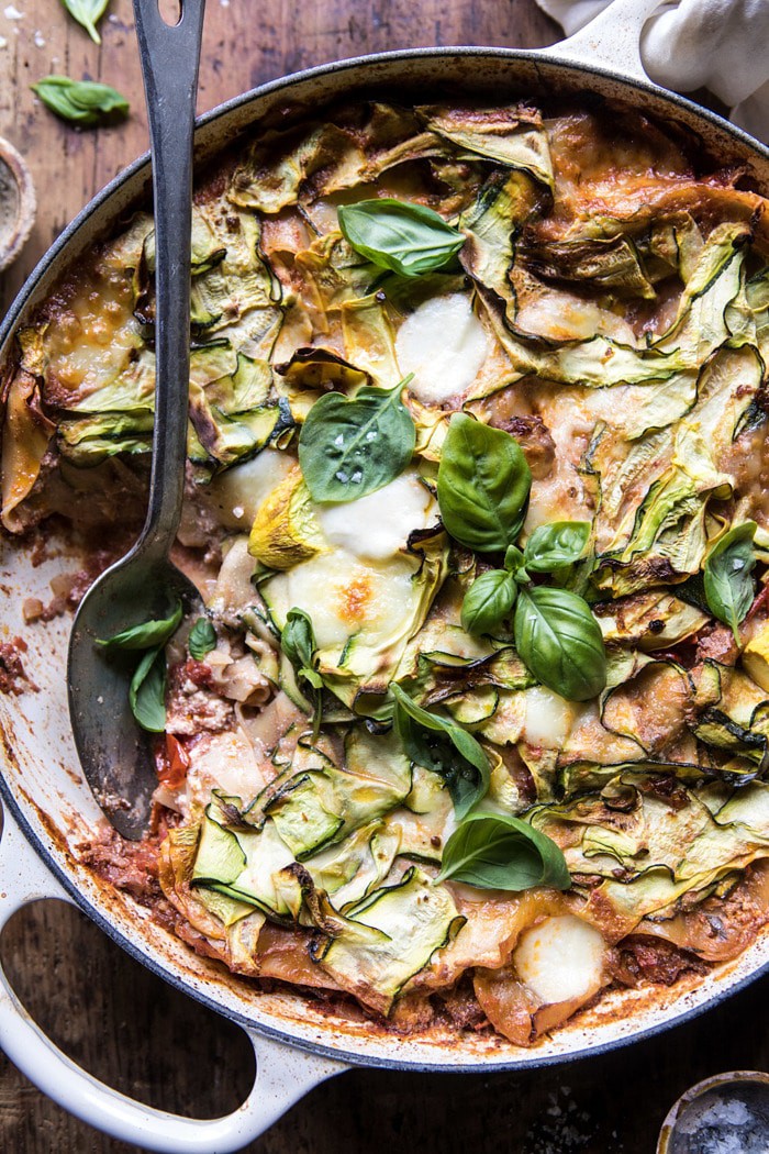 overhead photo of One Pan Zucchini and 3 Cheese Lasagna with spoon in dish