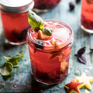 Smashed Berry Rose Spritz | halfbakedharvest.com #cocktails #4thofjulyrecipe #summerrecipes #easy