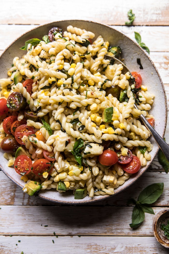 overhead photo of Corn, Tomato, and Avocado Pasta Salad