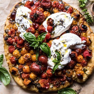 Garlic and Herb Roasted Cherry Tomato Pizza with Caramelized Onions.