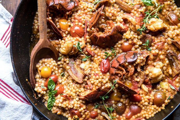 overhead horizontal photo of One Pot Tomato Basil Lobster and Herbed Pearl Couscous 