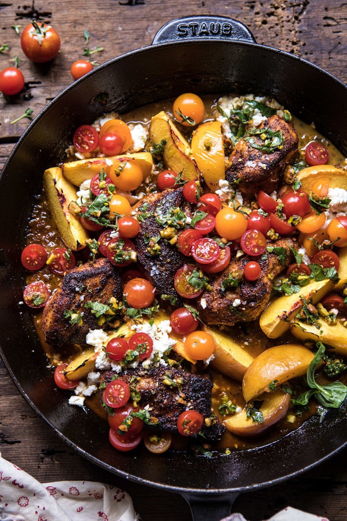 overhead close up photo of Skillet Moroccan Chicken with Tomatoes, Peaches, and Feta