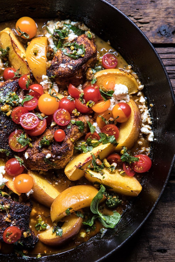 close up Skillet Moroccan Chicken with Tomatoes, Peaches, and Feta in skillet