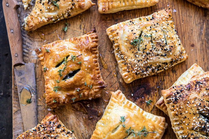 overhead horizontal photo of Caramelized Onion, Spinach, and Cheddar Flaky Pastries 