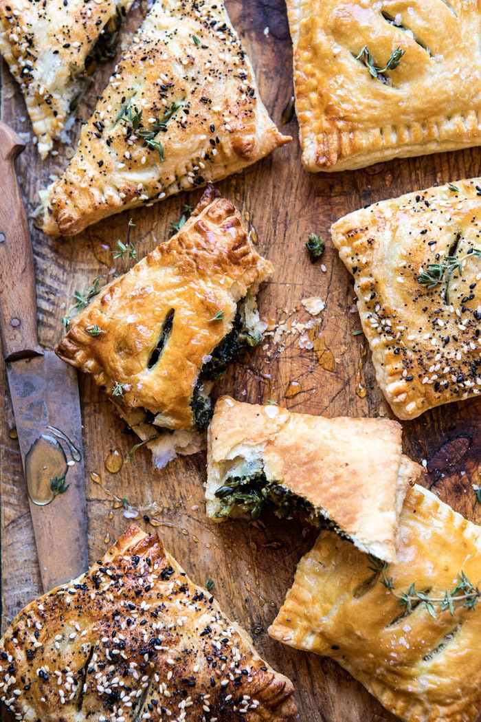 overhead photo of broken Caramelized Onion, Spinach, and Cheddar Flaky Pastry