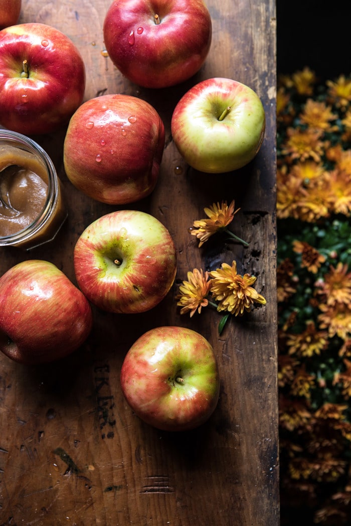 raw apples with flowers in photos