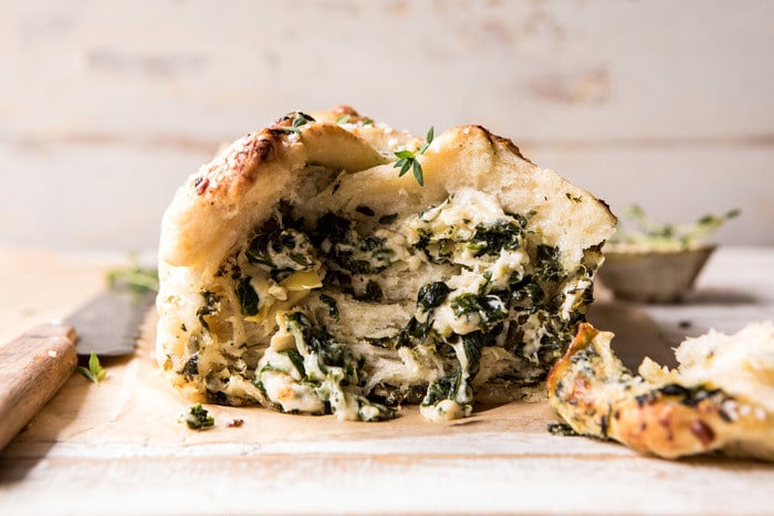 horizontal, front on photo of Herbed Spinach and Artichoke Pull Apart Pretzel Bread