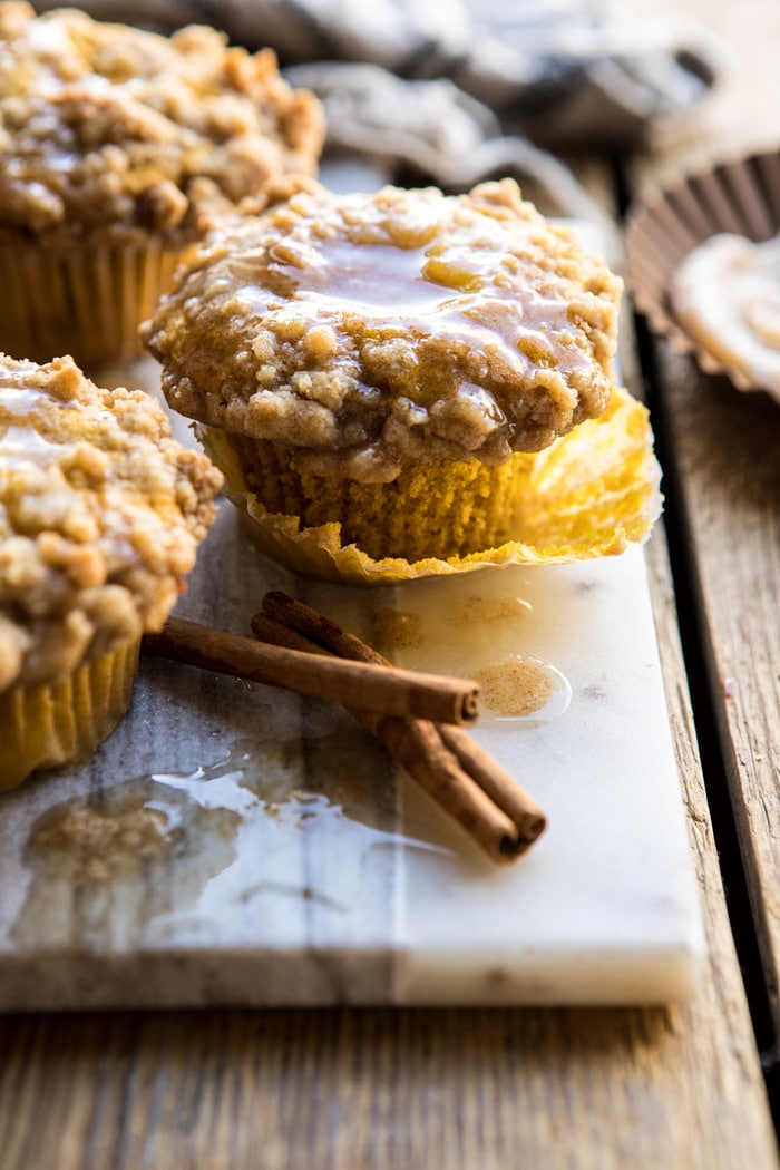 close up side angle photo of Pumpkin Coffee Cake Muffins with Cinnamon Honey Butter