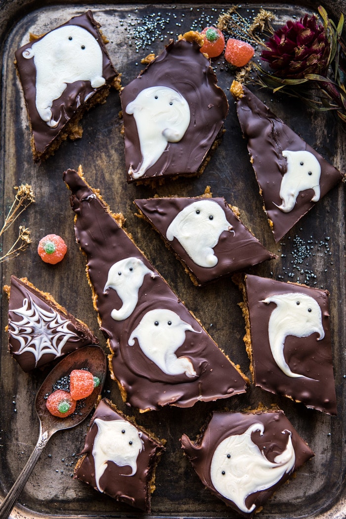 BOO! Chocolate Peanut Butter Bars on serving trey with candy pumpkins and a spoon