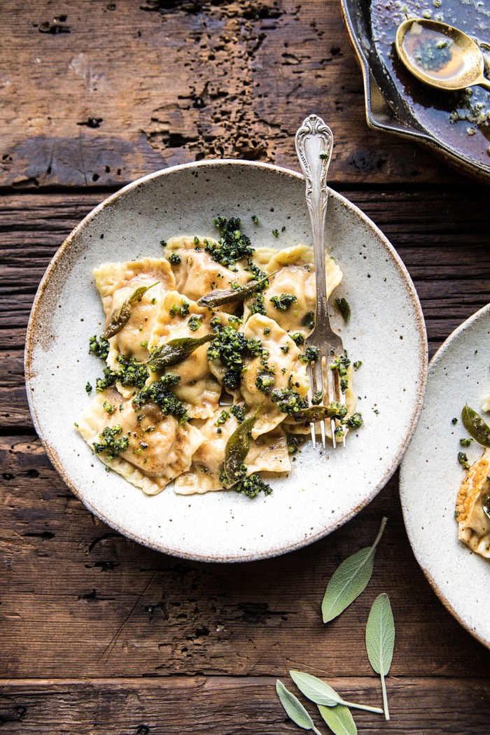 overhead photo of Butternut Squash Cheese Ravioli with Browned Butter Sage Pesto with skillet in photo 