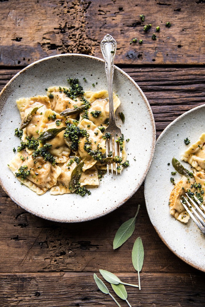 overhead photo of Butternut Squash Cheese Ravioli with Browned Butter Sage Pesto with 2 bowls in photo 