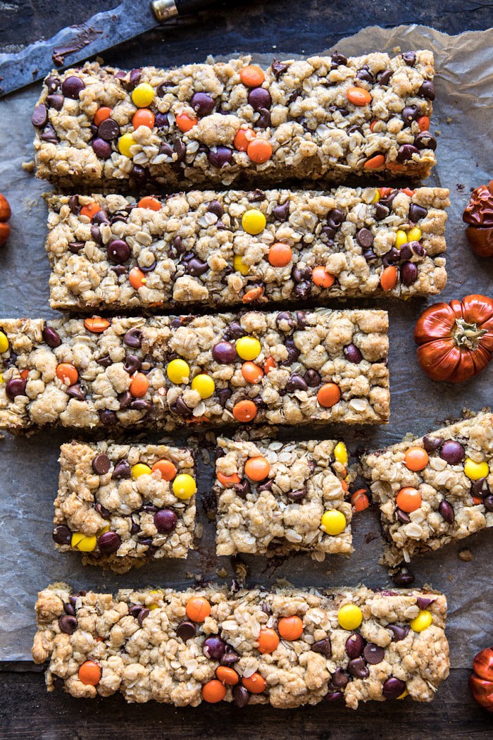 overhead photo Monster Oatmeal Chocolate Chip Cookie Bars with mini pumpkins in photo 