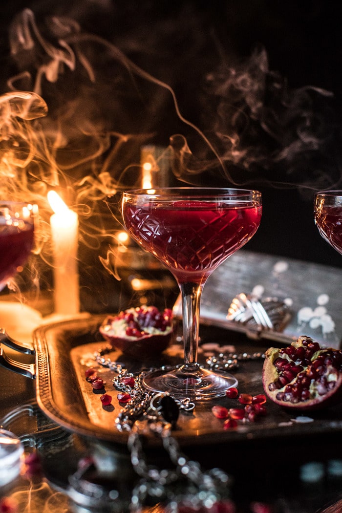 front on photo of The Half Blood Prince Cocktail with smoke and candles in photo 