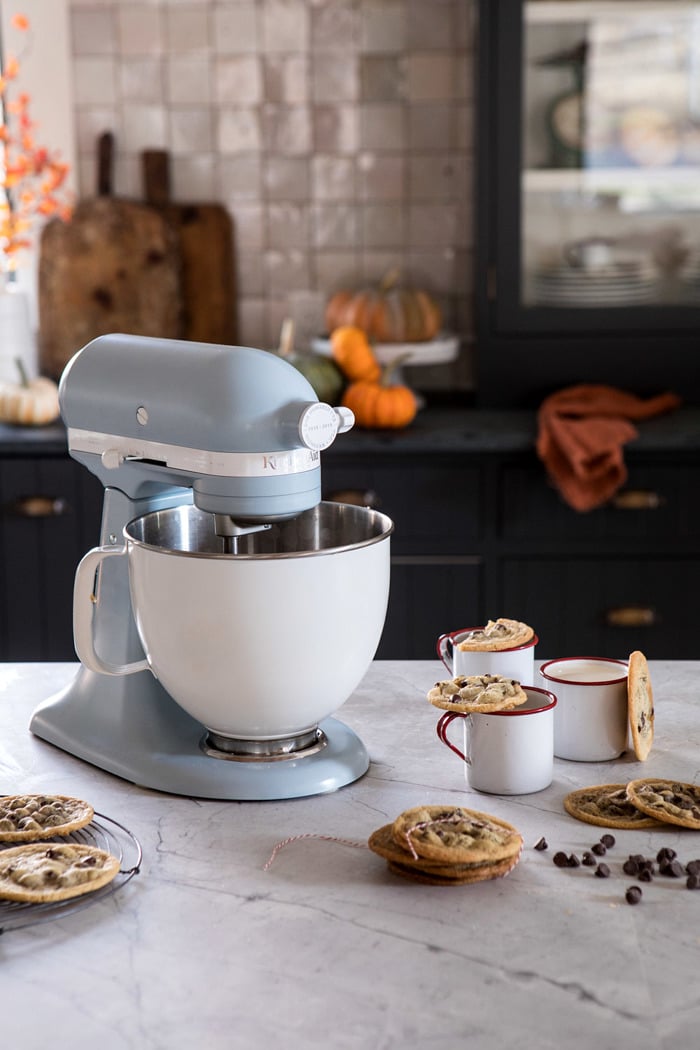 KitchenAid stand mixer sitting on counter with cookies on counter