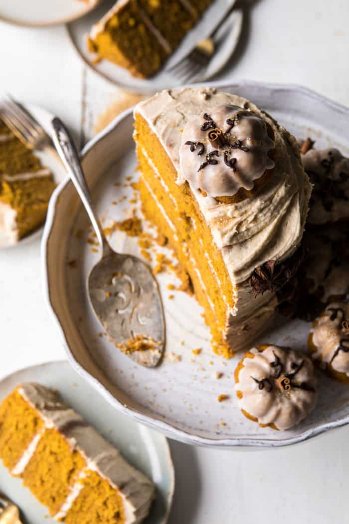 overhead photo half cut Chai Pumpkin Cake with Maple Browned Butter Frosting 