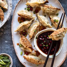Ginger Sesame Chicken Potstickers with Sweet Chili Pomegranate Sauce.