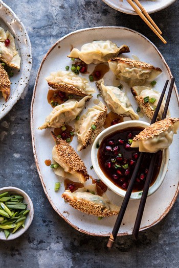 Ginger Sesame Chicken Potstickers with Sweet Chili Pomegranate Sauce.