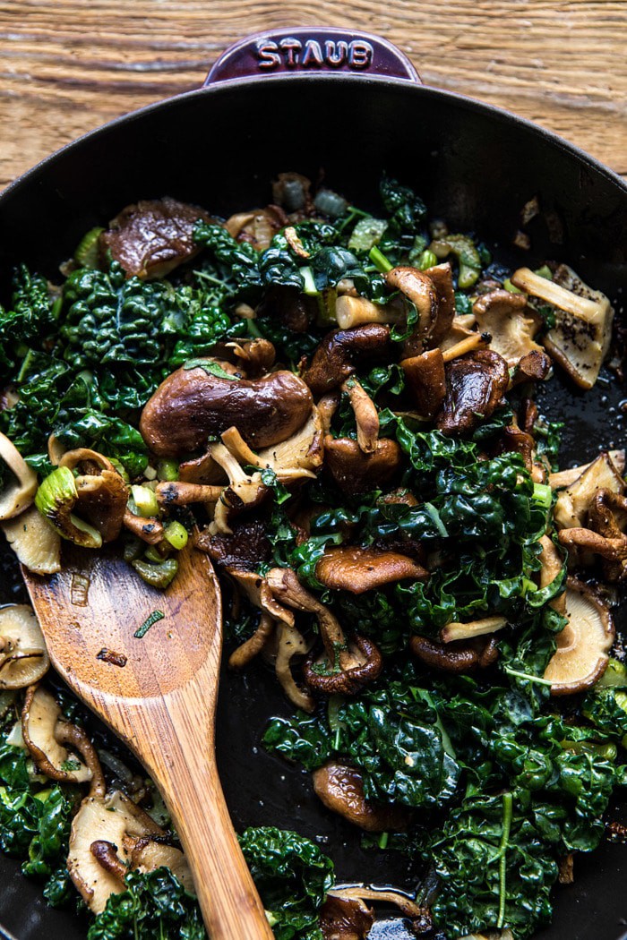 mushrooms and kale in skillet 