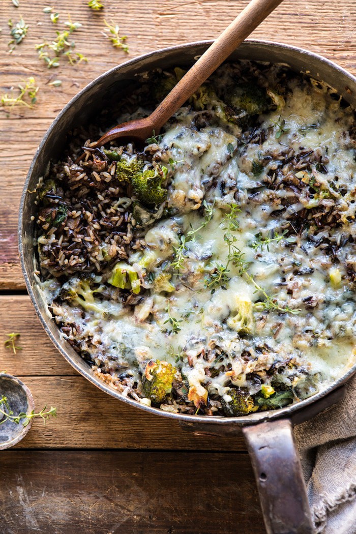 overhead photo of One Pan Broccoli Cheese Wild Rice Casserole with spoon in pan