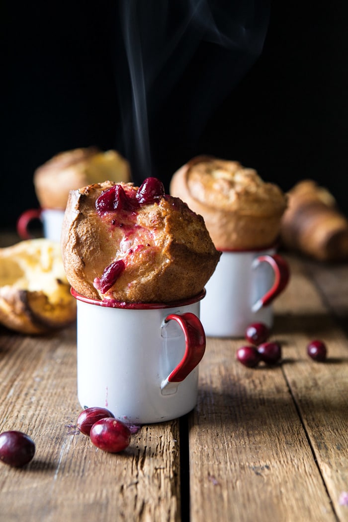 front on photo of Perfect Popovers with Cranberry Butter and steam coming out of popover 