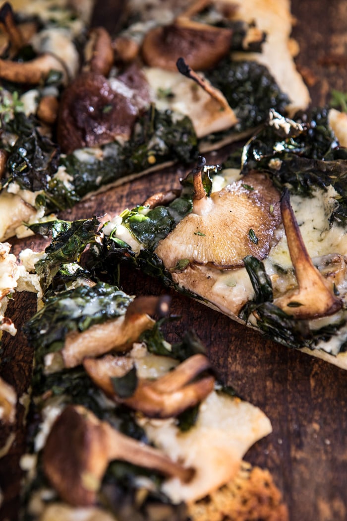 close up side angle photo of Roasted Mushroom Kale Pizza 