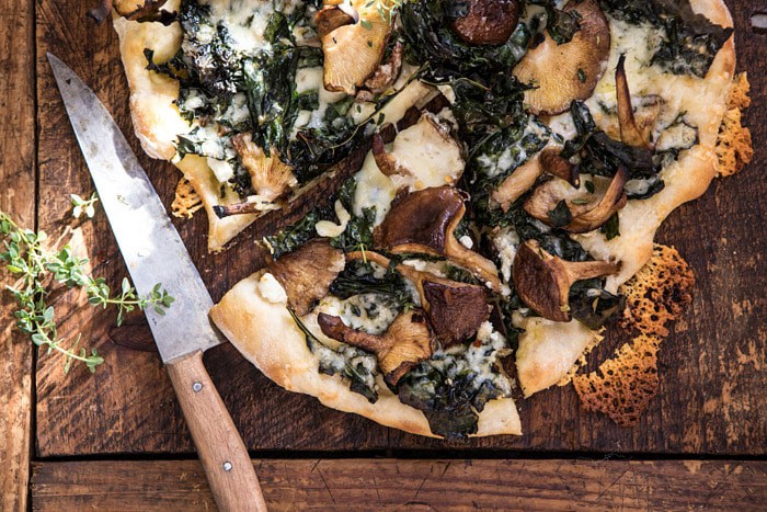 horizontal photo of Roasted Mushroom Kale Pizza 
