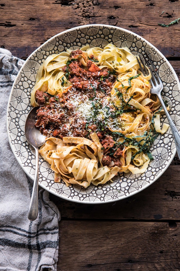 overhead photo of Slow Cooker Vodka Bolognese Pasta with spoons in bowl 