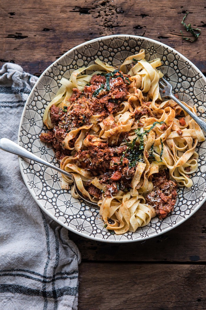 overhead photo of Slow Cooker Vodka Bolognese Pasta tossed together in serving bowl 