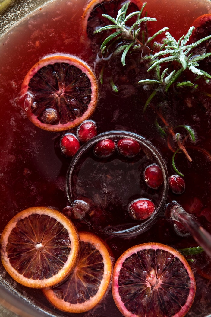 close up photo of Spiced Cranberry Rosé Spritzer in punch bowl 